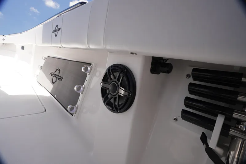 Slide: The Image of 2023 Fountain 38 Tournament Edition boat interior with speaker and rod holders. - 24