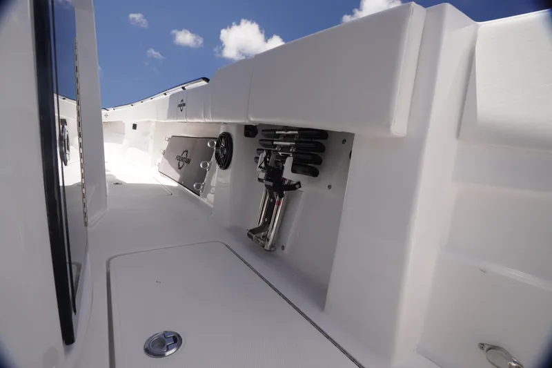Slide: The Image of 2023 Fountain 38 Tournament Edition boat interior with storage compartments and sleek design. - 25