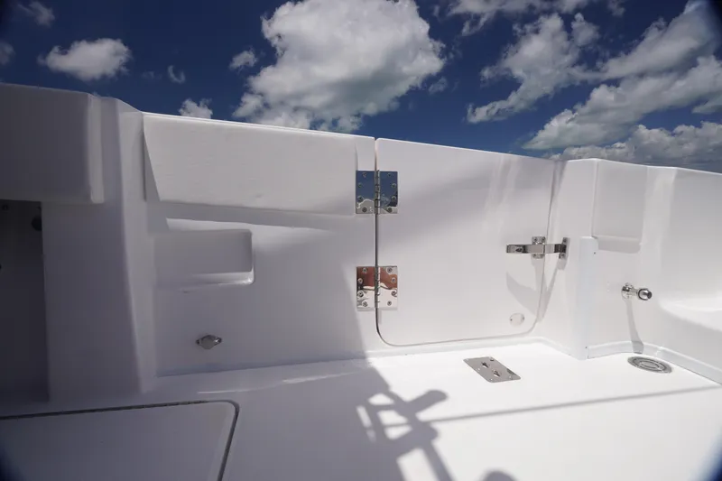 Slide: The Image of 2023 Fountain 38 Tournament Edition boat deck under a bright blue sky with clouds. - 26