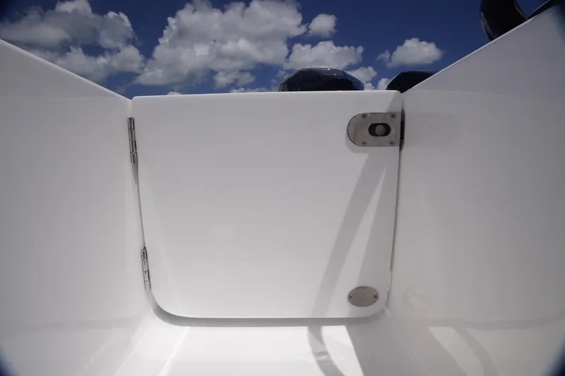 Slide: The Image of 2023 Fountain 38 Tournament Edition boat hatch under a clear blue sky with clouds. - 28