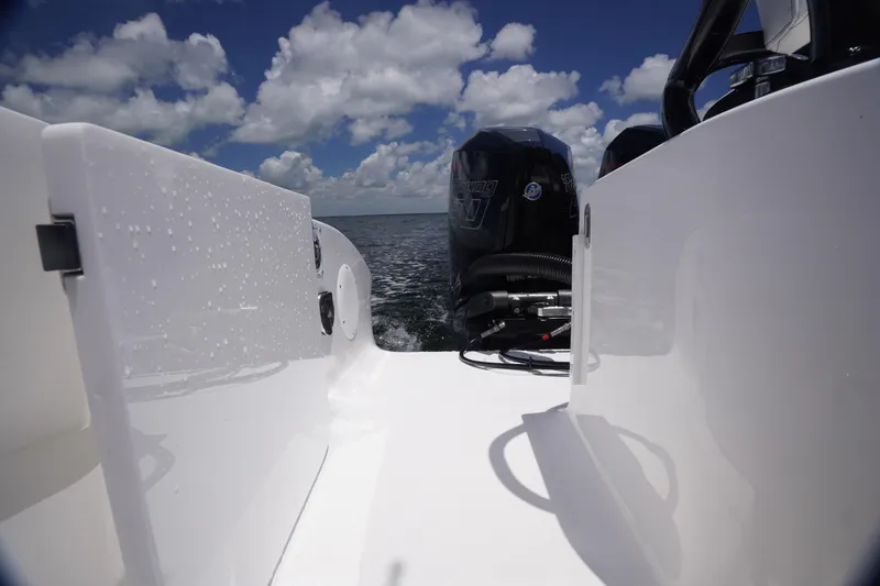 Slide: The Image of 2023 Fountain 38 Tournament Edition boat with powerful outboard engines on open water. - 29