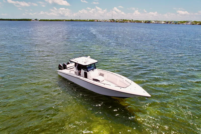 Slide: The Image of 2023 Fountain 38 Tournament Edition boat on clear blue water under a sunny sky. - 3