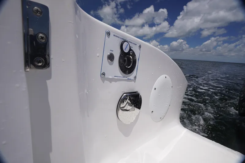 Slide: The Image of 2023 Fountain 38 Tournament Edition boat control panel on open water. - 30