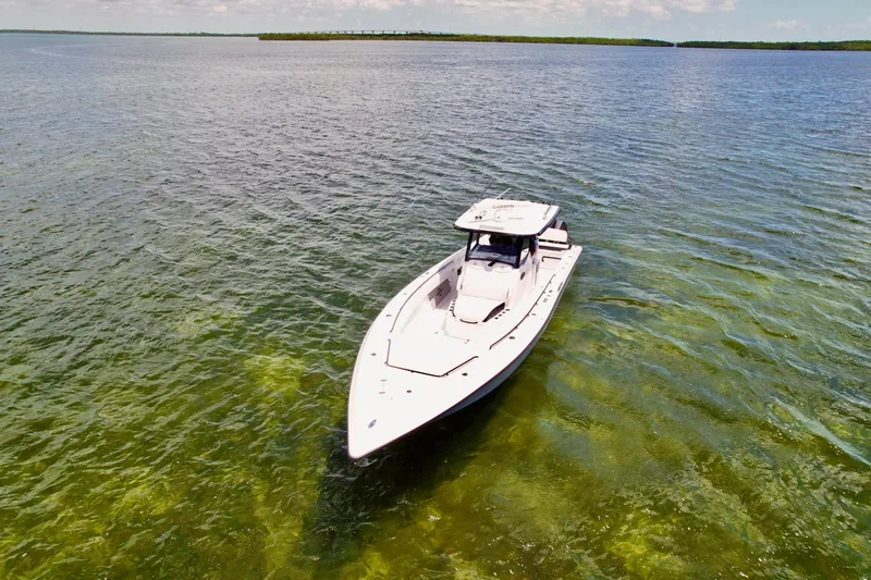 Slide: The Image of 2023 Fountain 38 Tournament Edition boat on clear, calm water. - 4