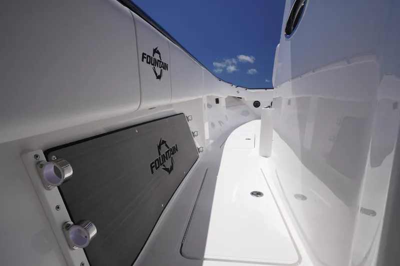 Slide: The Image of 2023 Fountain 38 Tournament Edition boat interior with sleek white design and branded details. - 45