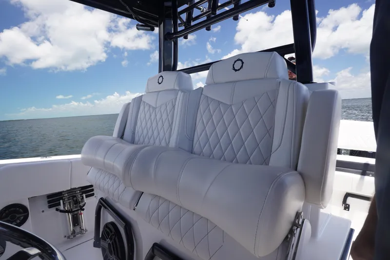 Slide: The Image of 2023 Fountain 38 Tournament Edition boat with luxurious seating on open water. - 48