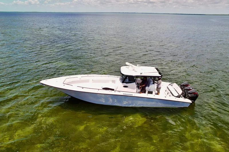 Slide: The Image of 2023 Fountain 38 Tournament Edition boat on clear ocean water under a partly cloudy sky. - 5