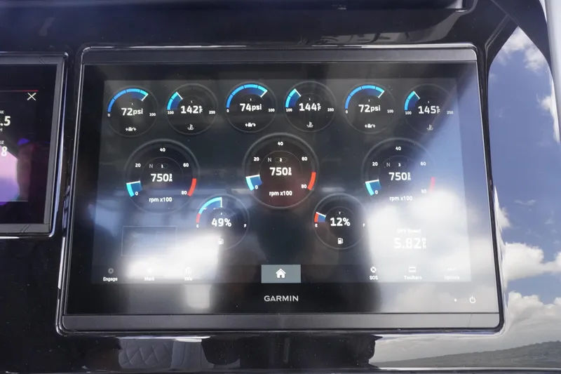 Slide: The Image of Garmin display on 2023 Fountain 38 Tournament Edition boat showing engine metrics and gauges. - 50