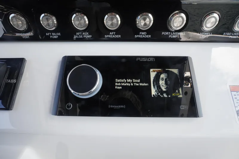Slide: The Image of Fusion stereo system on 2023 Fountain 38 Tournament Edition boat, playing Bob Marley. - 54