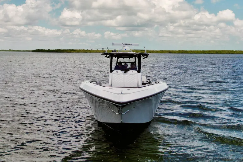 Slide: The Image of 2023 Fountain 38 Tournament Edition boat on open water under a cloudy sky. - 57