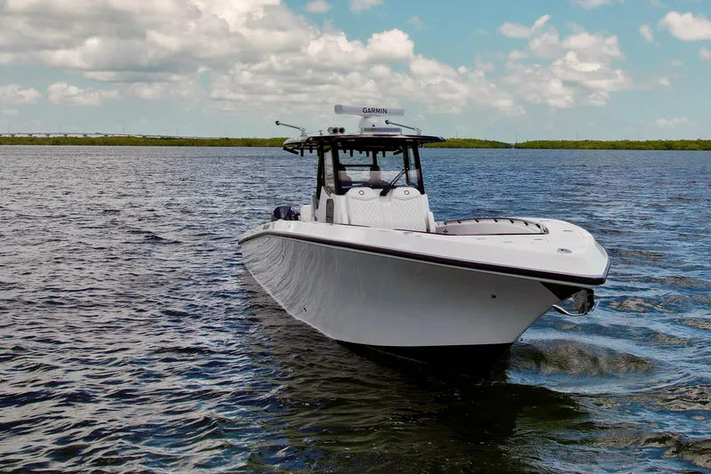 Slide: The Image of 2023 Fountain 38 Tournament Edition boat on open water under a cloudy sky. - 58