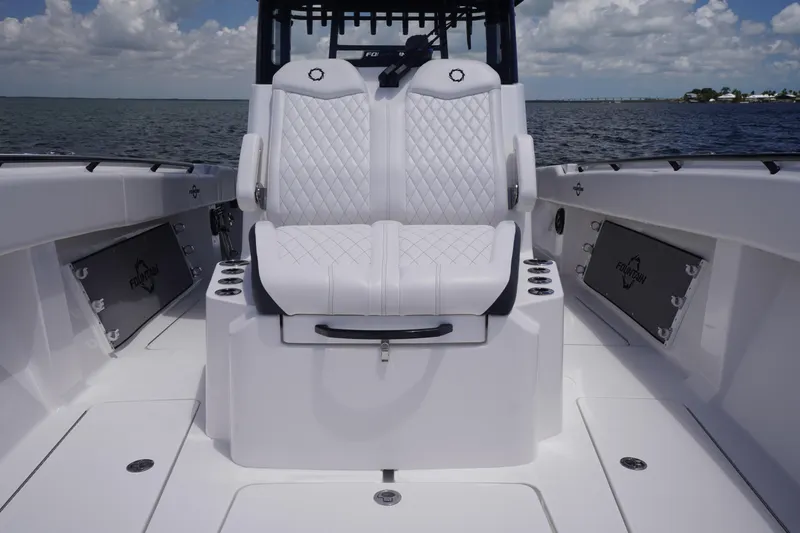 Slide: The Image of 2023 Fountain 38 Tournament Edition boat interior with luxurious seating and ocean backdrop. - 8