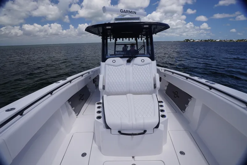 Slide: The Image of 2023 Fountain 38 Tournament Edition boat on open water under a cloudy sky. - 9