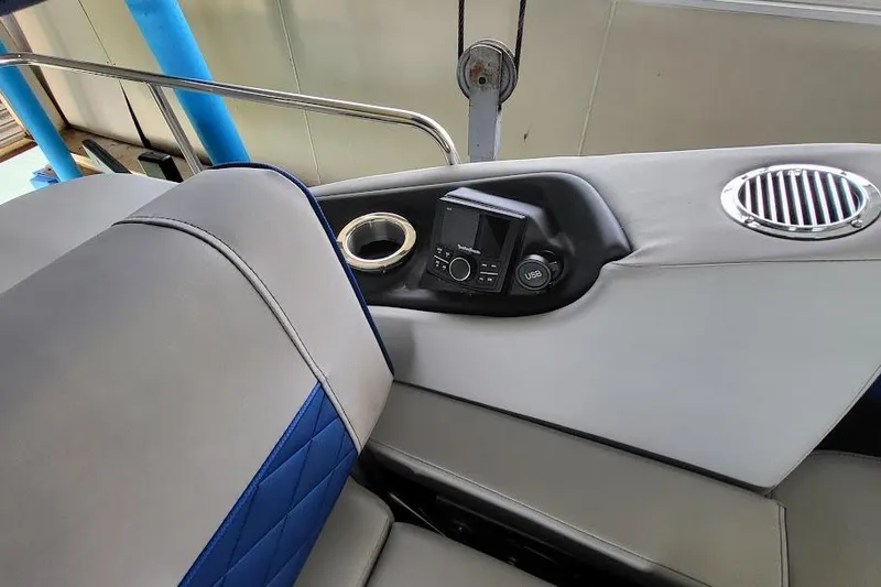Slide: The Image of Interior of 2023 Bennington L 25 Swingback boat with control panel and seating. - 12