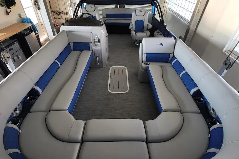 Slide: The Image of 2023 Bennington L 25 Swingback pontoon boat interior with spacious seating and modern design. - 2