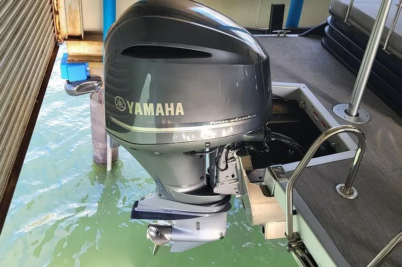 Slide: The Image of 2023 Bennington L 25 Swingback with Yamaha outboard motor on dock. - 4