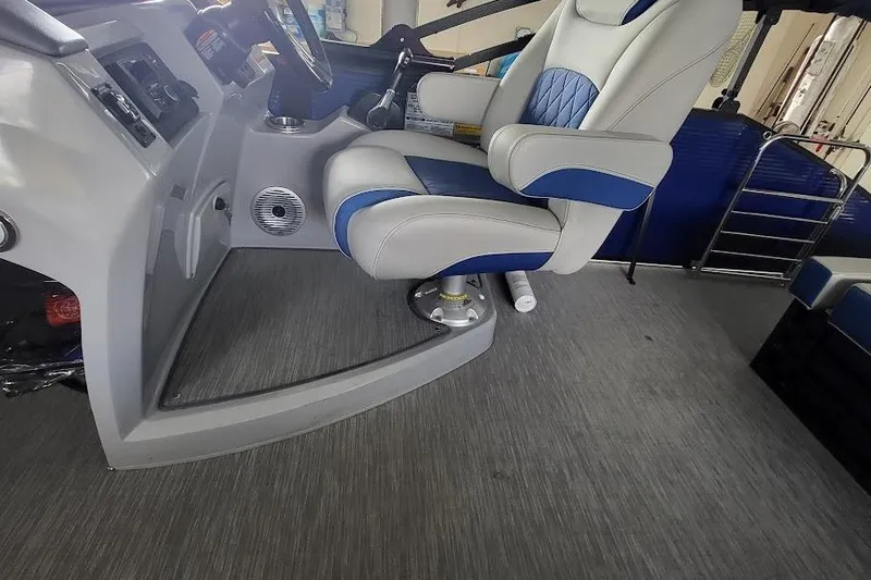 Slide: The Image of Captain's chair and helm of 2023 Bennington L 25 Swingback boat interior. - 8
