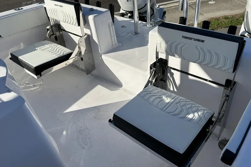 Slide: The Image of 2026 Twin Vee 260 GFX2 CC boat seats with modern design and white upholstery. - 12