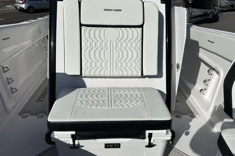 Slide: The Image of 2026 Twin Vee 260 GFX2 CC boat seat with Yeti cooler, featuring white upholstery. - 27