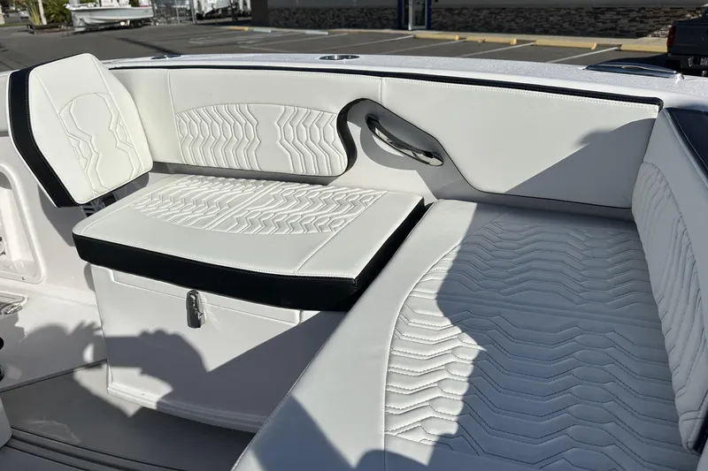 Slide: The Image of 2026 Twin Vee 260 GFX2 CC boat interior with stylish white seating and modern design. - 28