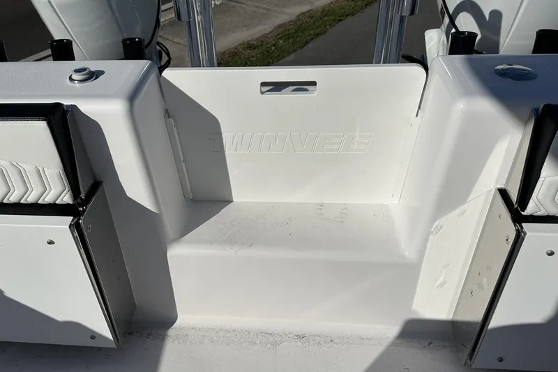 Slide: The Image of 2026 Twin Vee 260 GFX2 CC boat interior, featuring sleek white seating and design elements. - 31