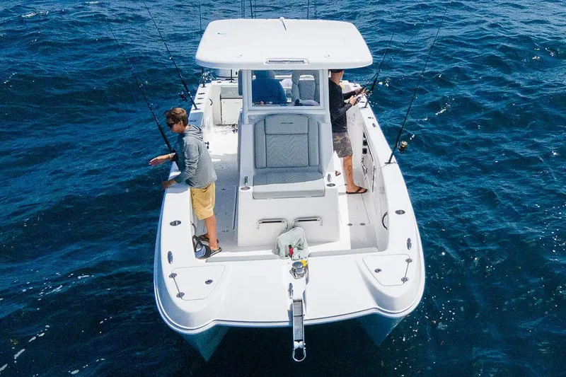 Slide: The Image of Manufacturer Provided Image: 2026 Twin Vee 260 GFX2 CC boat with two people fishing on open water. - 32