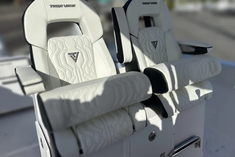 Slide: The Image of Luxury seating on 2026 Twin Vee 260 GFX2 CC boat, featuring elegant white upholstery. - 9