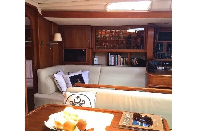 Slide: The Image of Luxurious interior of 1997 Gorbon Custom 66 yacht with elegant wood finishes and cozy seating. - 130