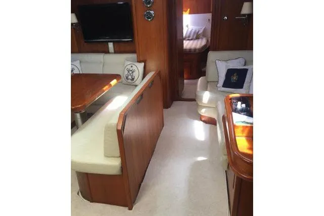 Slide: The Image of Luxurious interior of 1997 Gorbon Custom 66 yacht with elegant seating and wooden finishes. - 137