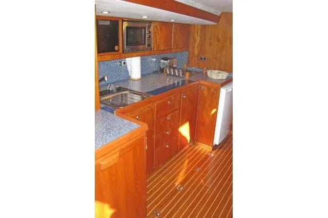 Slide: The Image of Luxurious wooden kitchen interior of 1997 Gorbon Custom 66 yacht with modern amenities. - 139