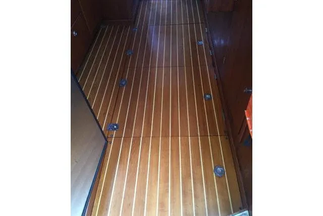 Slide: The Image of Polished wooden floor of 1997 Gorbon Custom 66 yacht interior. - 149