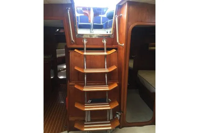 Slide: The Image of Interior of 1997 Gorbon Custom 66 yacht with wooden ladder and cozy cabin spaces. - 153
