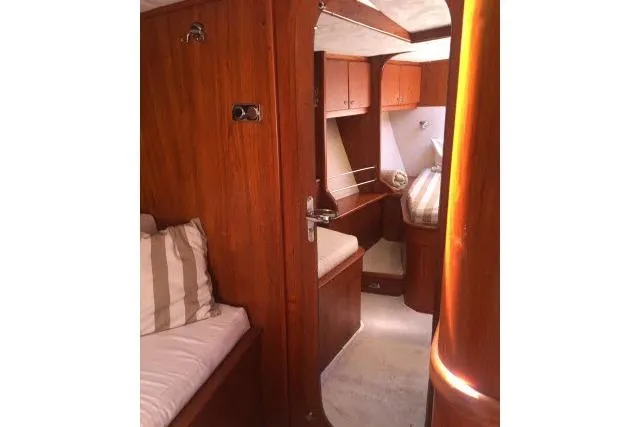 Slide: The Image of Interior of 1997 Gorbon Custom 66 yacht with wooden furnishings and cozy cabin space. - 160