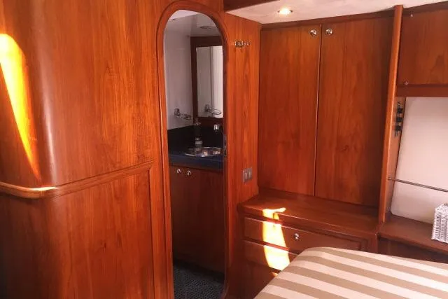 Slide: The Image of Luxurious wooden interior of 1997 Gorbon Custom 66 yacht cabin with ensuite bathroom. - 161