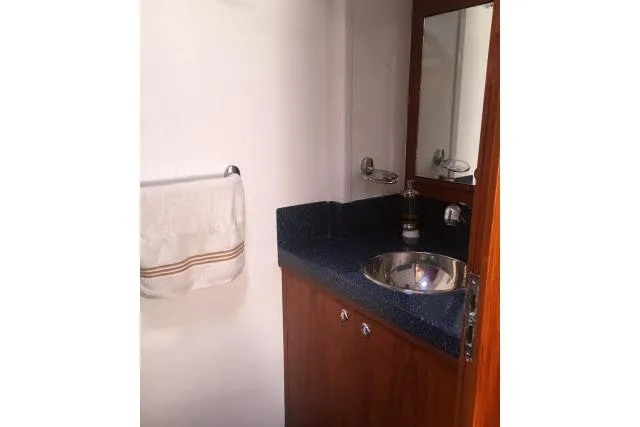 Slide: The Image of Bathroom vanity in 1997 Gorbon Custom 66 yacht with sink and mirror. - 165