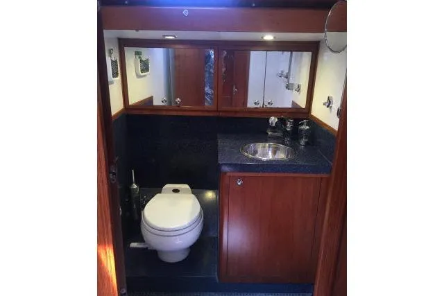 Slide: The Image of Luxurious bathroom in 1997 Gorbon Custom 66 yacht with wooden cabinetry and modern fixtures. - 177