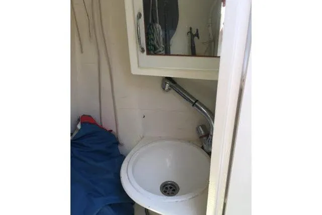 Slide: The Image of Compact bathroom sink in a 1997 Gorbon Custom 66 yacht. - 186