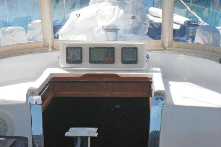Slide: The Image of Cockpit of 1997 Gorbon Custom 66 yacht with navigation instruments and wooden hatch. - 190
