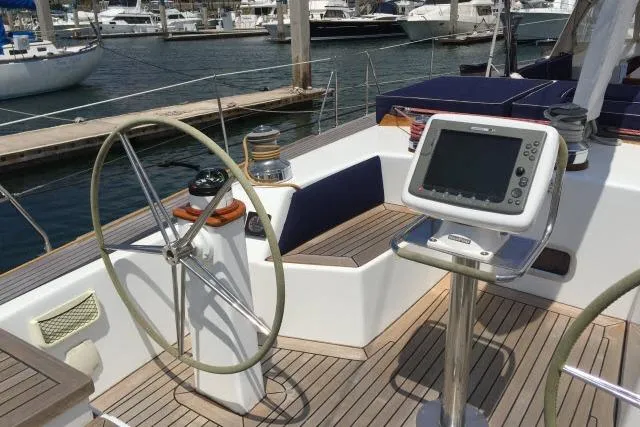 Slide: The Image of Cockpit of 1997 Gorbon Custom 66 yacht with steering wheel and navigation system. - 197