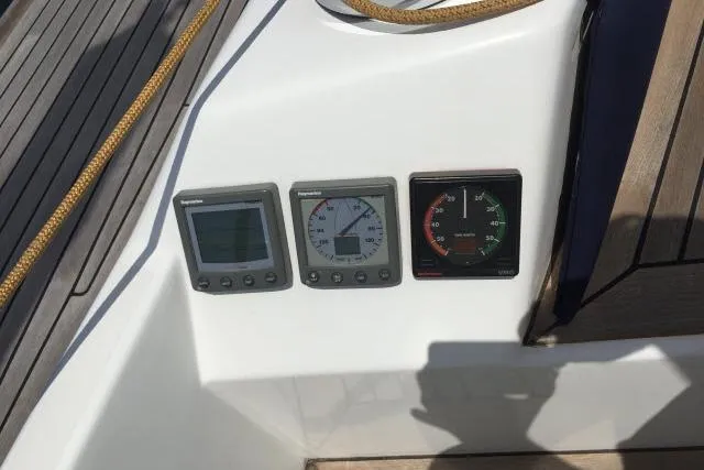 Slide: The Image of Control panel on a 1997 Gorbon Custom 66 yacht with navigation instruments. - 199
