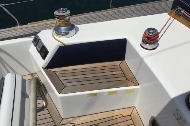 Slide: The Image of Deck of 1997 Gorbon Custom 66 yacht with winches and wooden seating. - 200