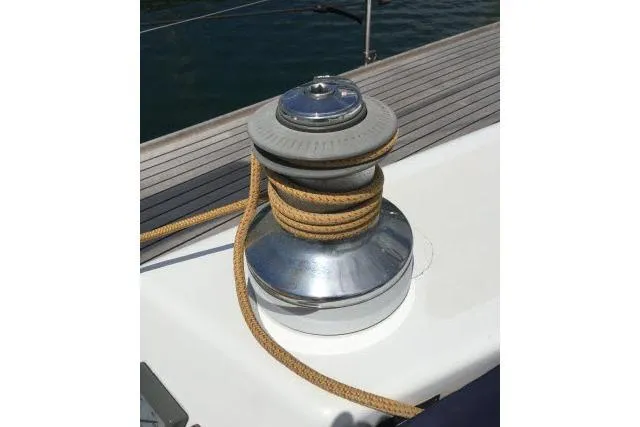 Slide: The Image of Winch on 1997 Gorbon Custom 66 yacht deck with coiled rope. - 201
