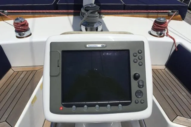 Slide: The Image of Cockpit of 1997 Gorbon Custom 66 yacht with navigation display and winches. - 203
