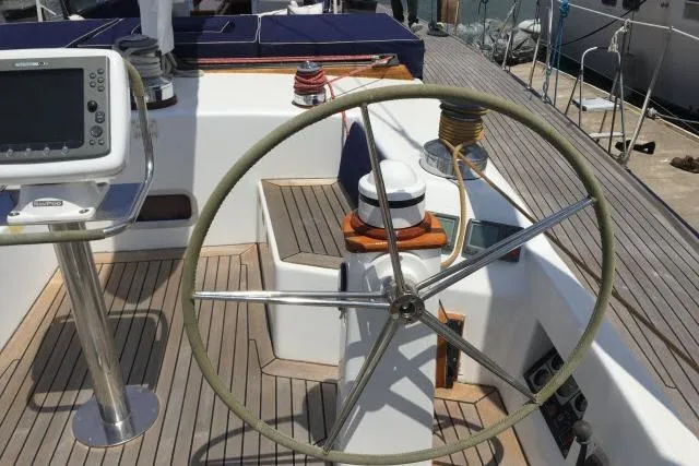 Slide: The Image of Steering wheel and navigation equipment on a 1997 Gorbon Custom 66 yacht deck. - 204