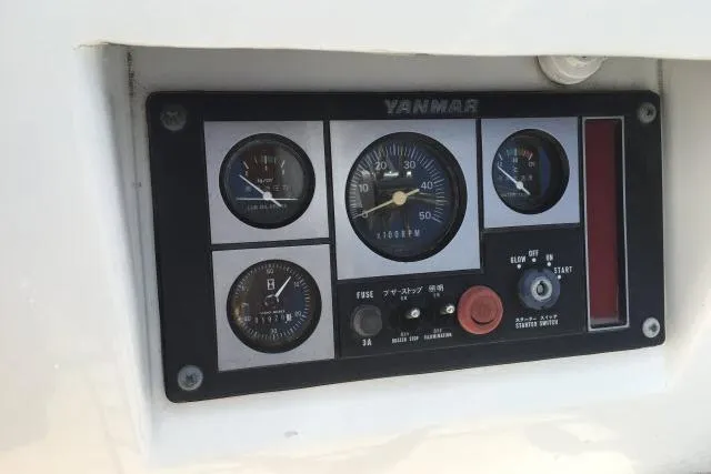 Slide: The Image of Control panel of a 1997 Gorbon Custom 66 with Yanmar gauges and switches. - 207