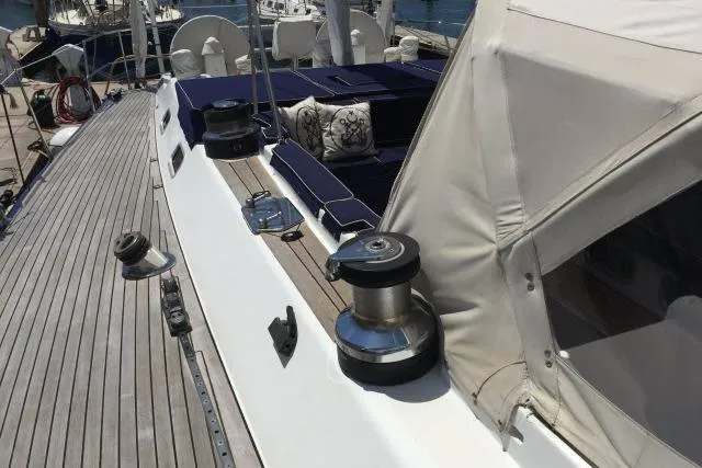 Slide: The Image of Deck view of a 1997 Gorbon Custom 66 yacht with winches and seating area. - 213