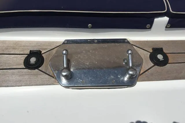 Slide: The Image of Deck hardware on 1997 Gorbon Custom 66 yacht, featuring metal fittings and wooden accents. - 214