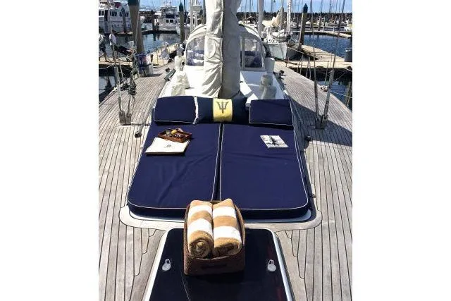 Slide: The Image of Luxurious 1997 Gorbon Custom 66 yacht deck with sunbathing cushions and towels. - 217