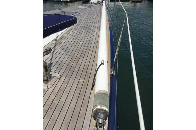 Slide: The Image of Deck view of 1997 Gorbon Custom 66 yacht with wooden flooring and railing. - 219