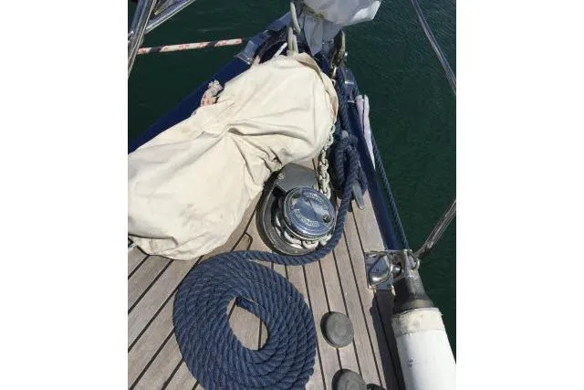 Slide: The Image of Deck of 1997 Gorbon Custom 66 yacht with coiled rope and sail cover. - 220